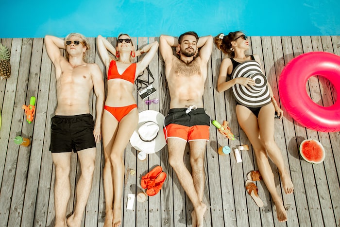 Friends sunbathing on the swimming pool 2022 01 18 23 56 08 utc