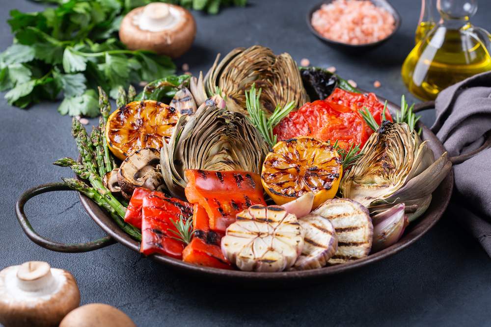 Vegan keto summer eating concept. A variety of grilled vegetables in a pan. Delicious, vegan, and keto.