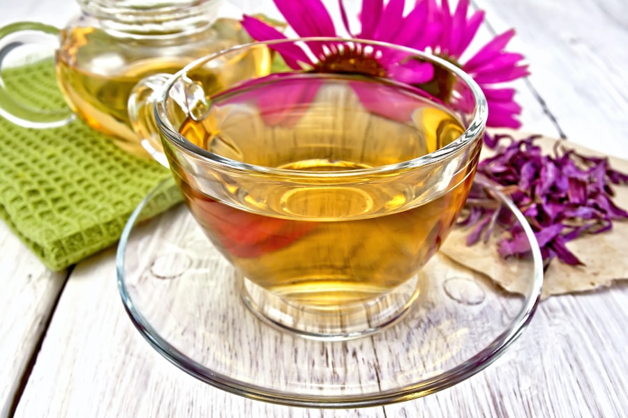 Tea echinacea in glass cup on board with napkin 2021 07 29 21 03 47 utc